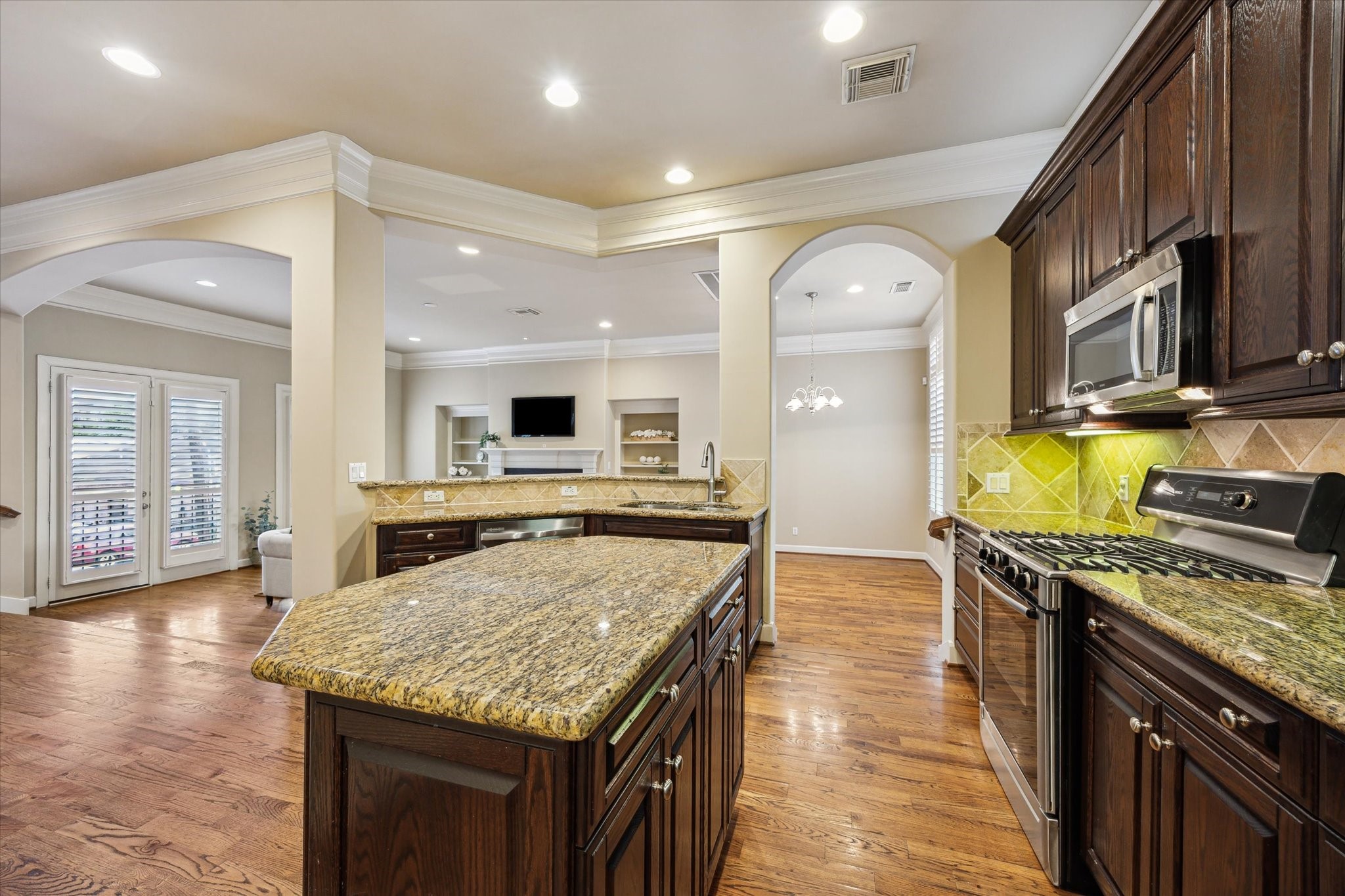 2006 Helena Street Houston, TX 77002 - Photo 13 of 38 a kitchen with stainless steel appliances granite countertop a stove and cabinets
