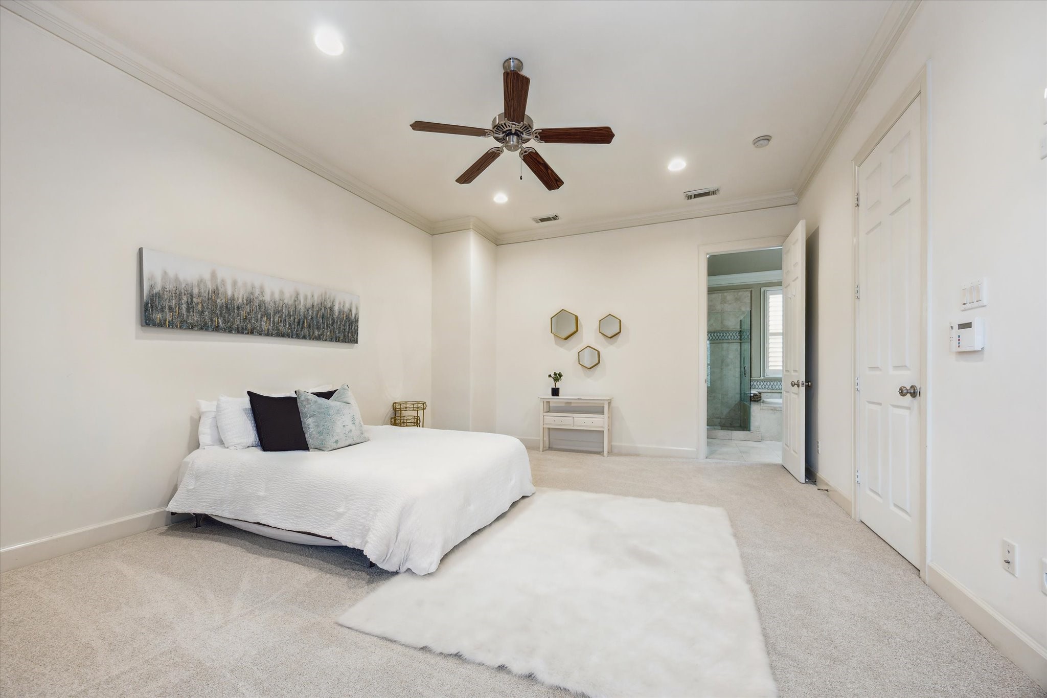2006 Helena Street Houston, TX 77002 - Photo 16 of 38 a bedroom with a large bed and a chandelier