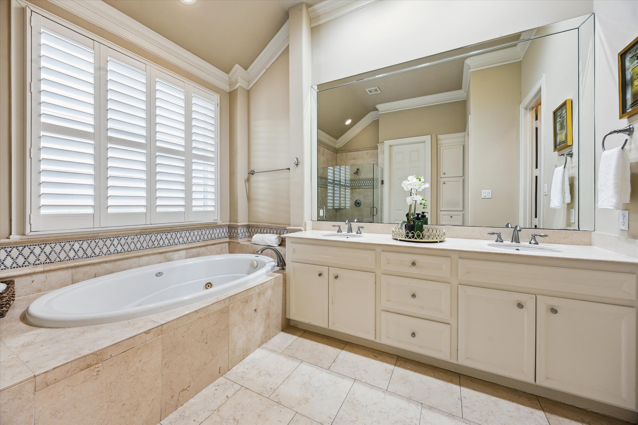2006 Helena Street Houston, TX 77002 - Photo 19 of 38 a spacious bathroom with a granite countertop tub sink and mirror
