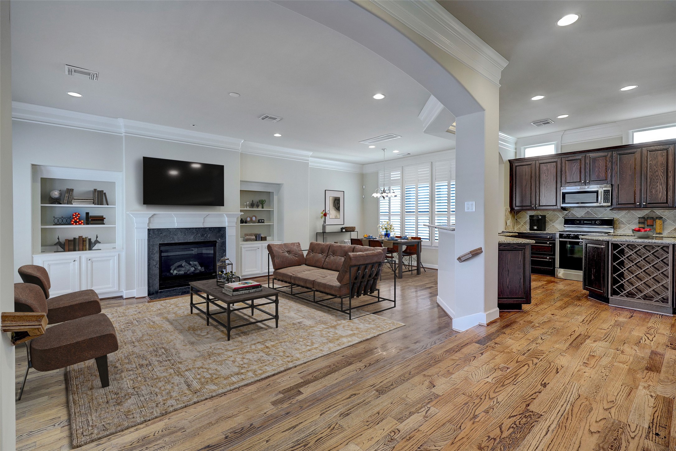 2006 Helena Street Houston, TX 77002 - Photo 10 of 38 a living room with furniture a flat screen tv and a fireplace