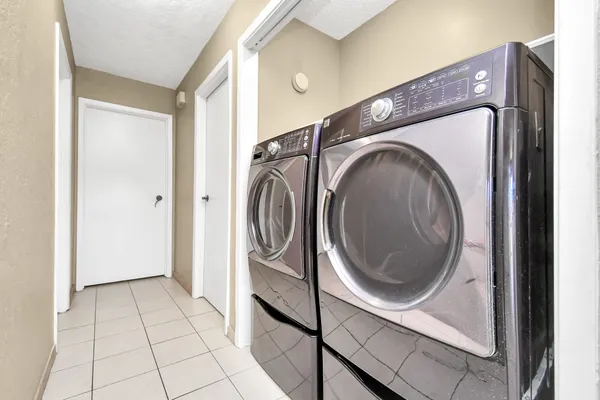 a utility room with dryer and washer