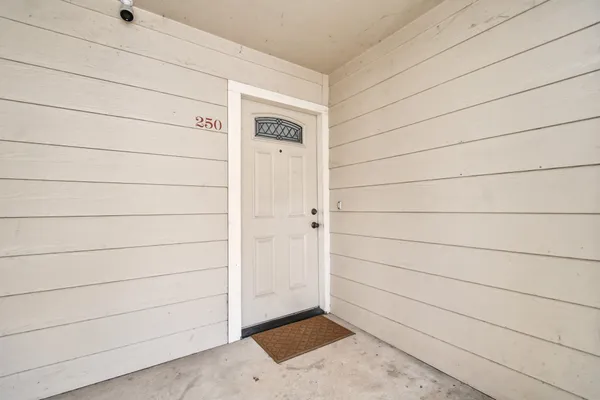 a view of balcony with wooden floor and fence
