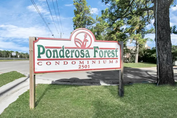 a view of house with outdoor space and sitting area