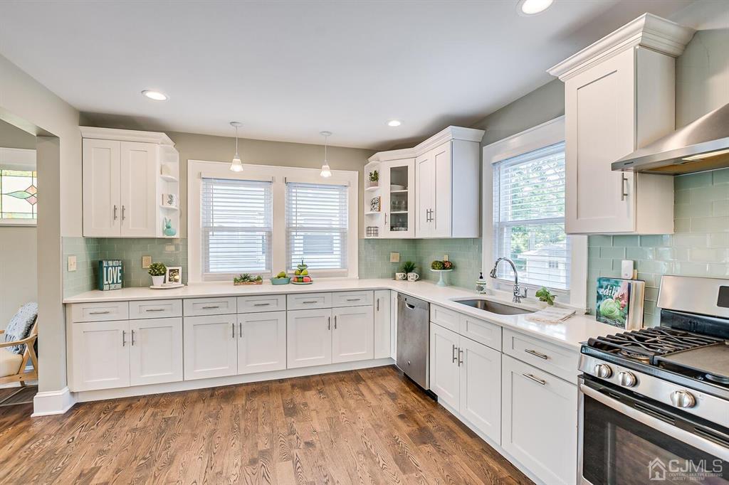 79 Van Ness Terrace Maplewood, NJ 07040 - Photo 15 of 40 a kitchen with a sink stove and cabinets