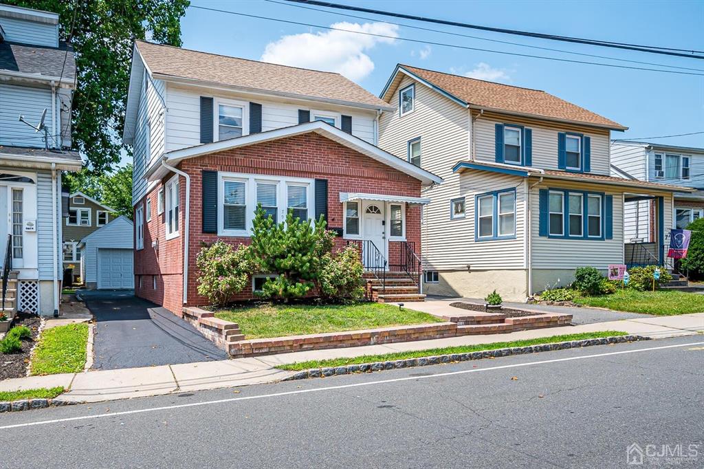 79 Van Ness Terrace Maplewood, NJ 07040 - Photo 2 of 40 a front view of a house with a yard and table and chairs