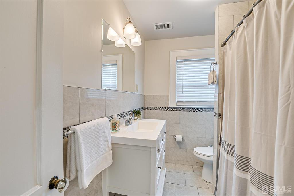 79 Van Ness Terrace Maplewood, NJ 07040 - Photo 26 of 40 a bathroom with a sink toilet and shower