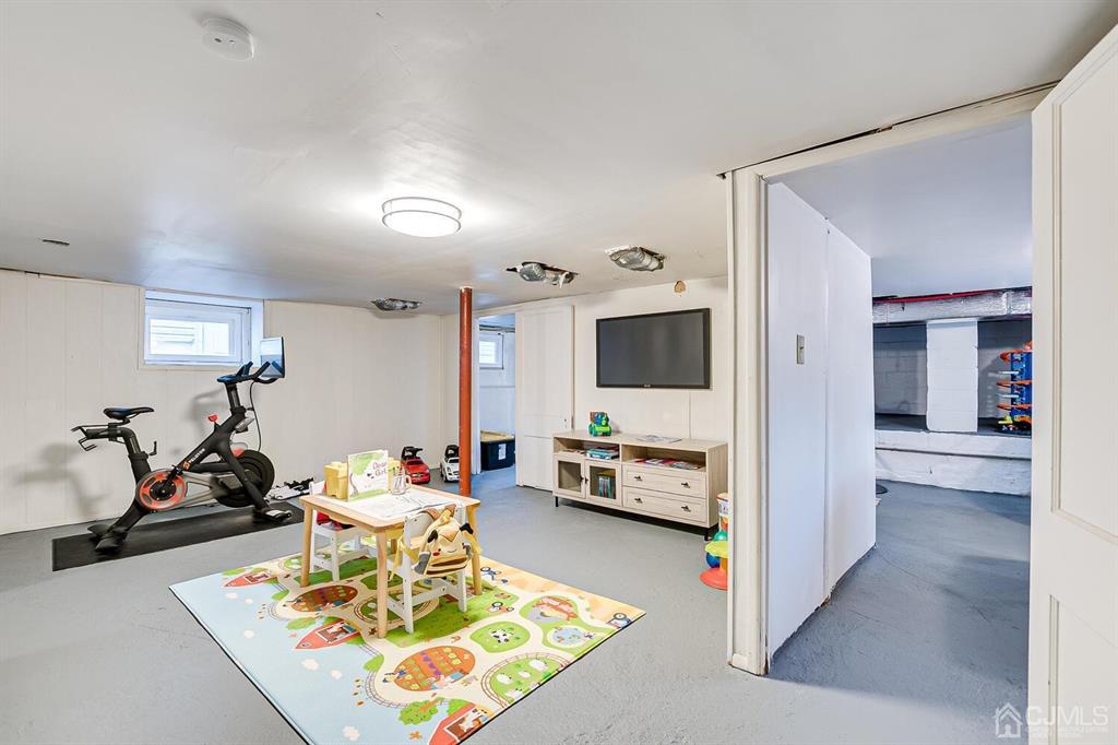 79 Van Ness Terrace Maplewood, NJ 07040 - Photo 32 of 40 a living room with furniture and a flat screen tv
