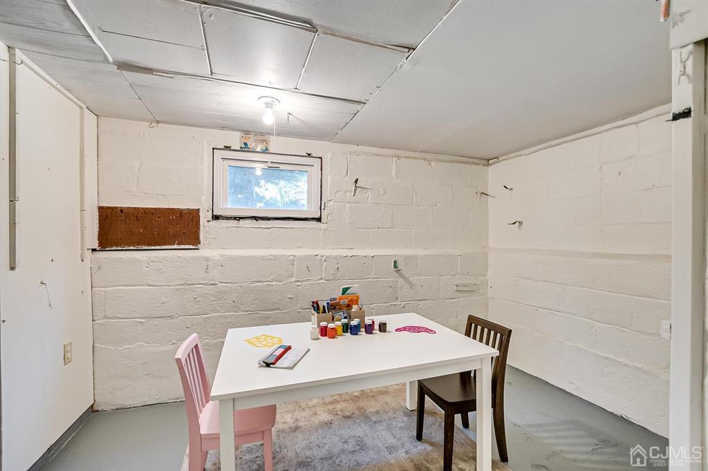 79 Van Ness Terrace Maplewood, NJ 07040 - Photo 35 of 40 a bathroom with a table chairs and a dining table