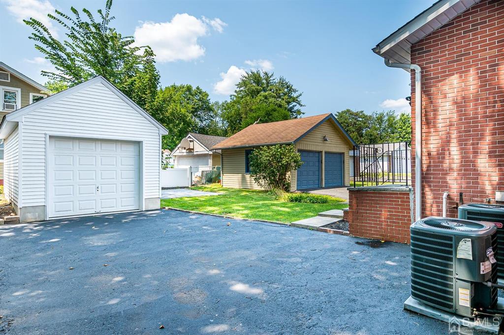 79 Van Ness Terrace Maplewood, NJ 07040 - Photo 37 of 40 a view of a house with a yard and a large tree