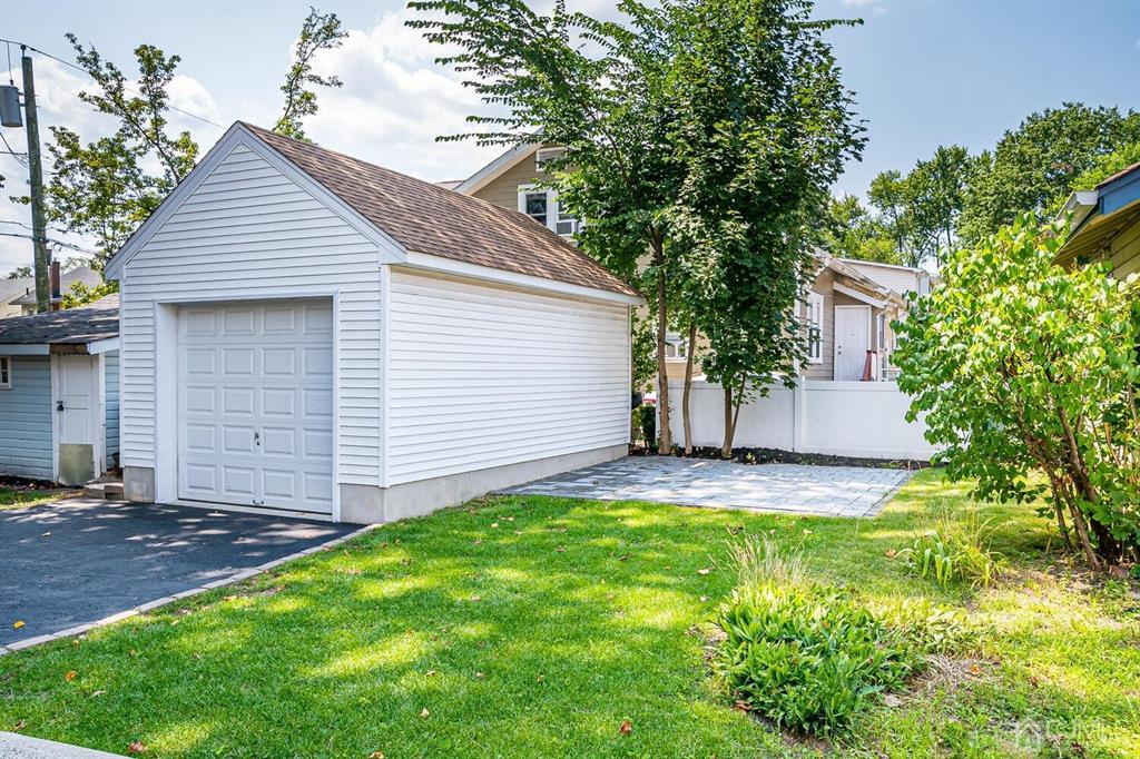 79 Van Ness Terrace Maplewood, NJ 07040 - Photo 40 of 40 a front view of a house with a yard and garage