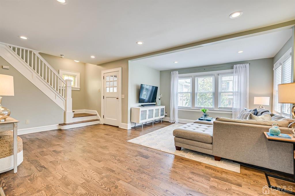 79 Van Ness Terrace Maplewood, NJ 07040 - Photo 7 of 40 a living room with fireplace furniture and a large window