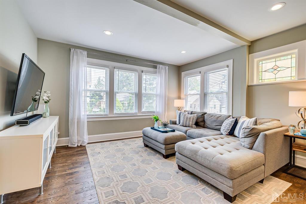 79 Van Ness Terrace Maplewood, NJ 07040 - Photo 8 of 40 a living room with furniture and a flat screen tv