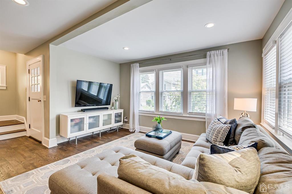 79 Van Ness Terrace Maplewood, NJ 07040 - Photo 9 of 40 a living room with furniture and a flat screen tv