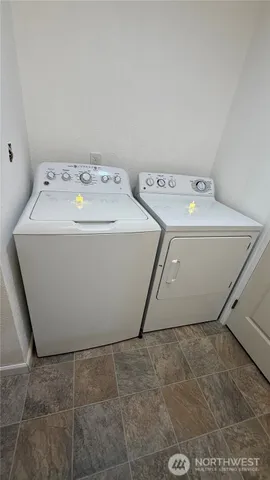 a utility room with washer and dryer