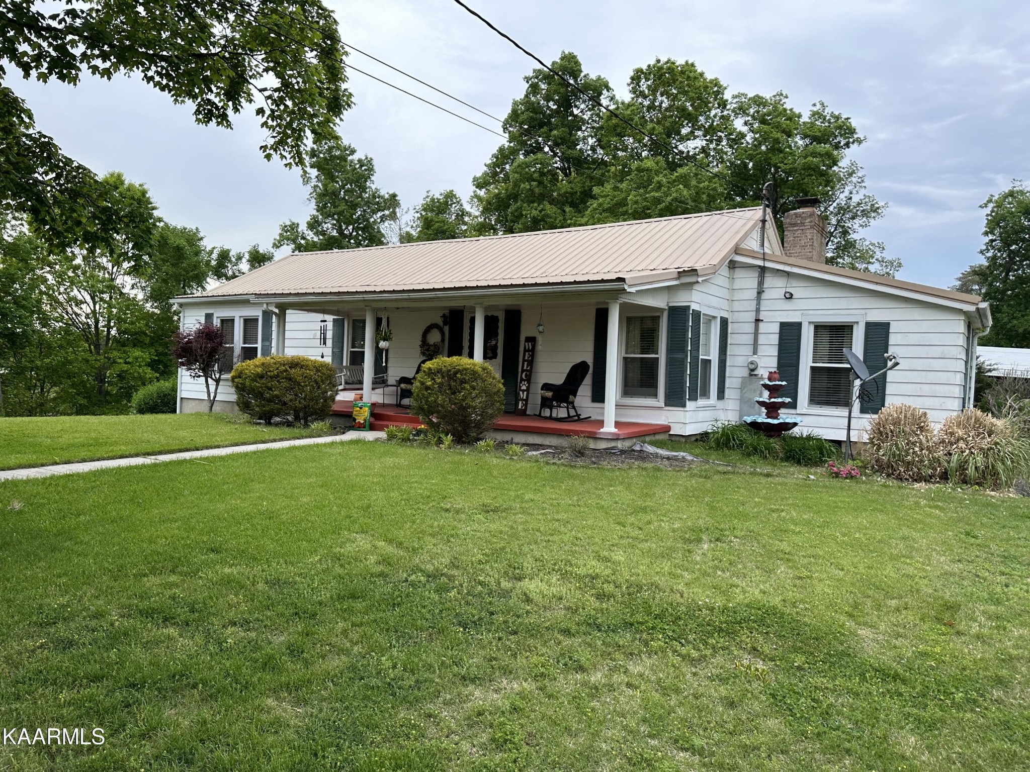 2512 Kennedy Road Knoxville, TN 37914 - Photo 3 of 10 a view of a house with a yard and sitting area