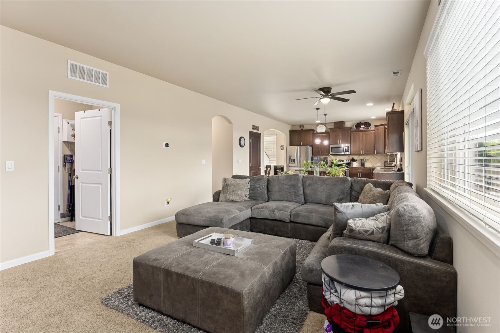 103 Balmer Street Southwest Orting, WA 98360 - Photo 13 of 30 a living room with furniture and a large window