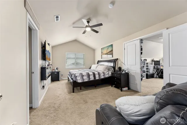 a bedroom with furniture and a chandelier