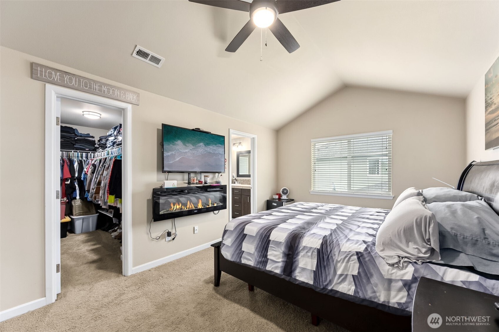 103 Balmer Street Southwest Orting, WA 98360 - Photo 17 of 30 a bedroom with a bed and a flat tv screen