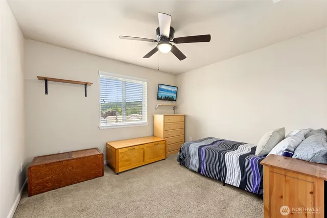 a bedroom with furniture and a window
