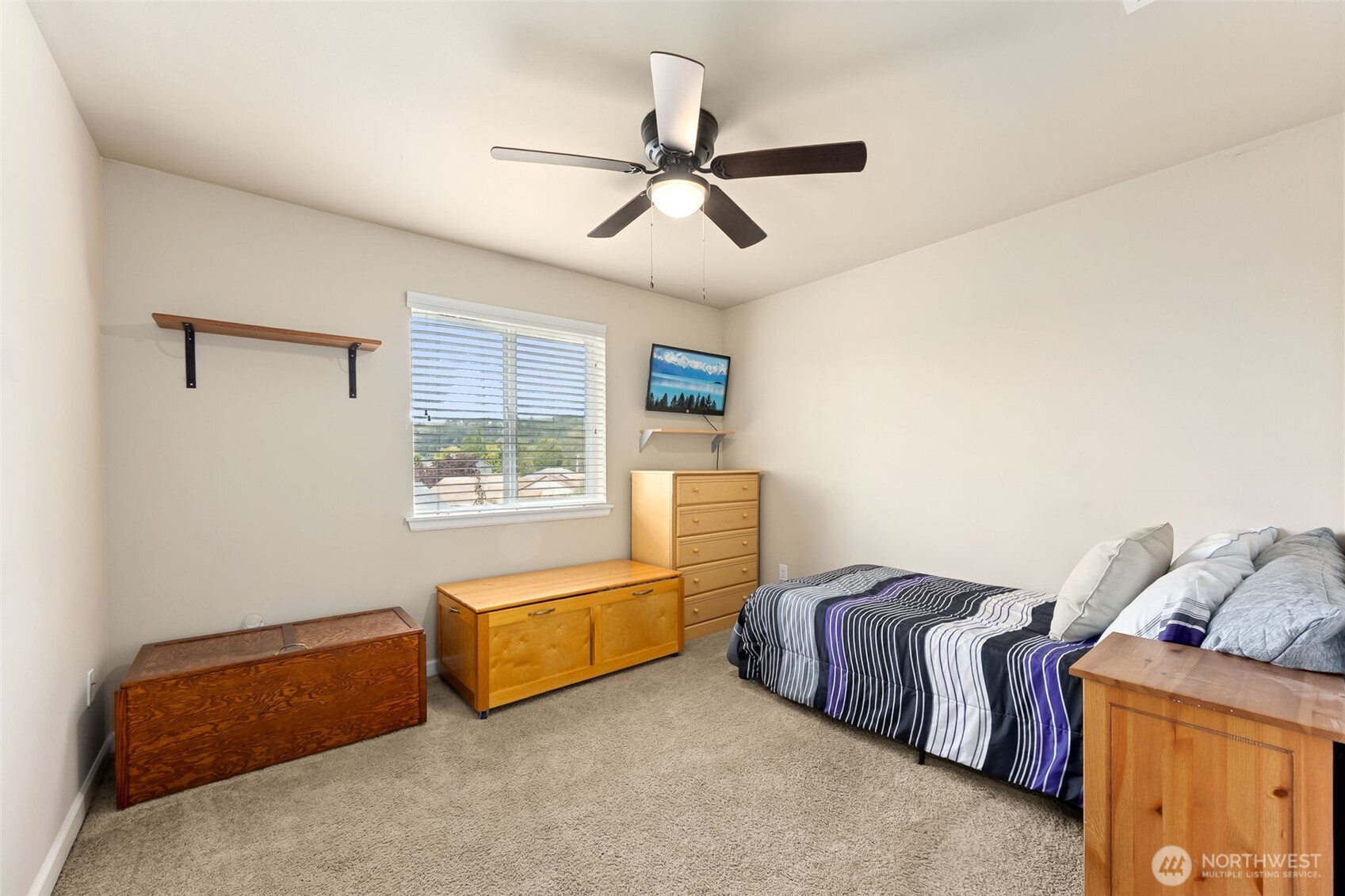 103 Balmer Street Southwest Orting, WA 98360 - Photo 23 of 30 a bedroom with furniture and a window
