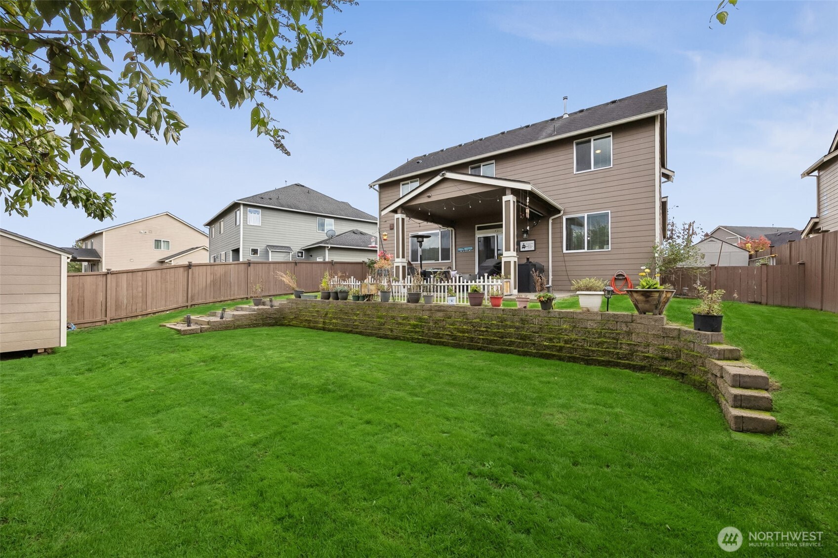 103 Balmer Street Southwest Orting, WA 98360 - Photo 28 of 30 a front view of house with yard and green space
