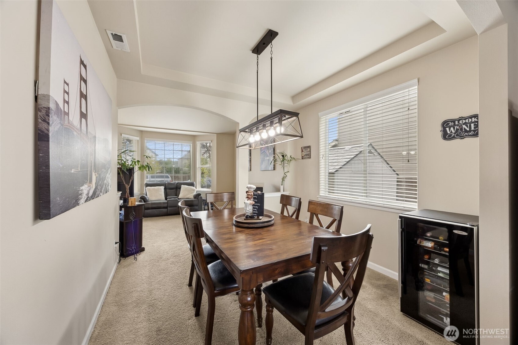 103 Balmer Street Southwest Orting, WA 98360 - Photo 7 of 30 a view of a dining room with furniture and chandelier