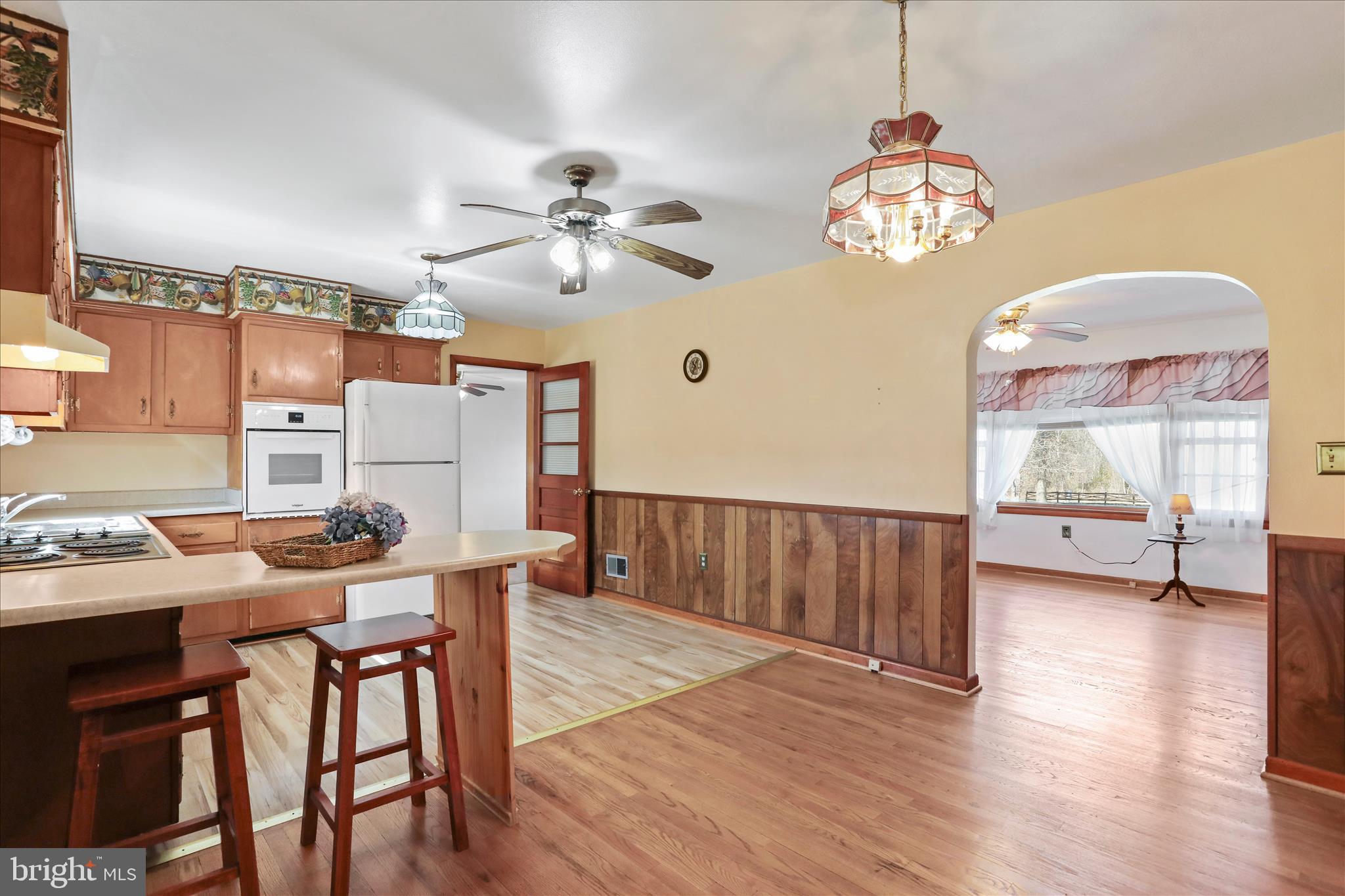 550 Bucks Mill Road Strasburg, VA 22657 - Photo 11 of 57 a view of a dining room with furniture window and wooden floor