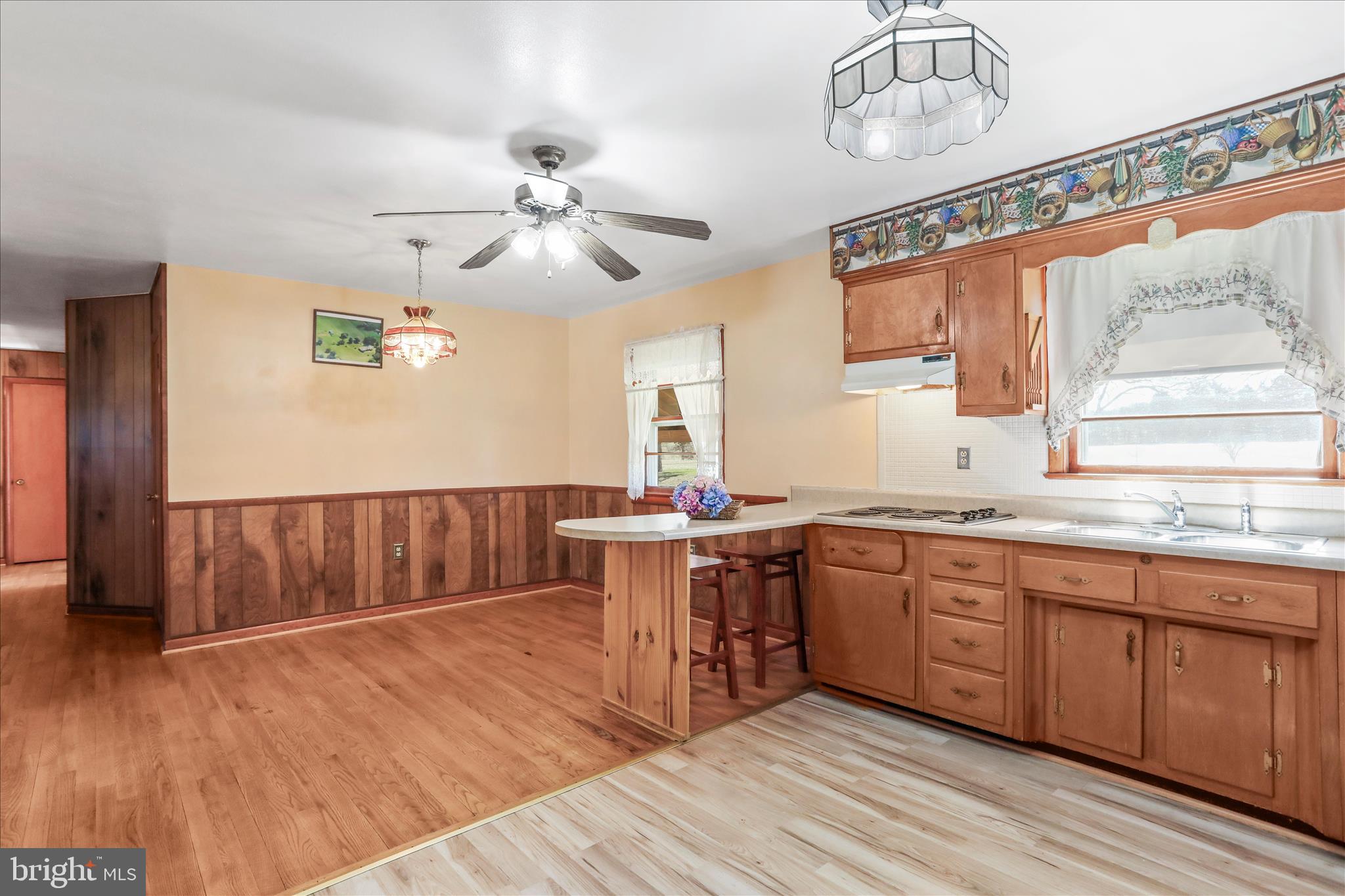 550 Bucks Mill Road Strasburg, VA 22657 - Photo 12 of 57 a kitchen with stainless steel appliances granite countertop a sink cabinets and wooden floor