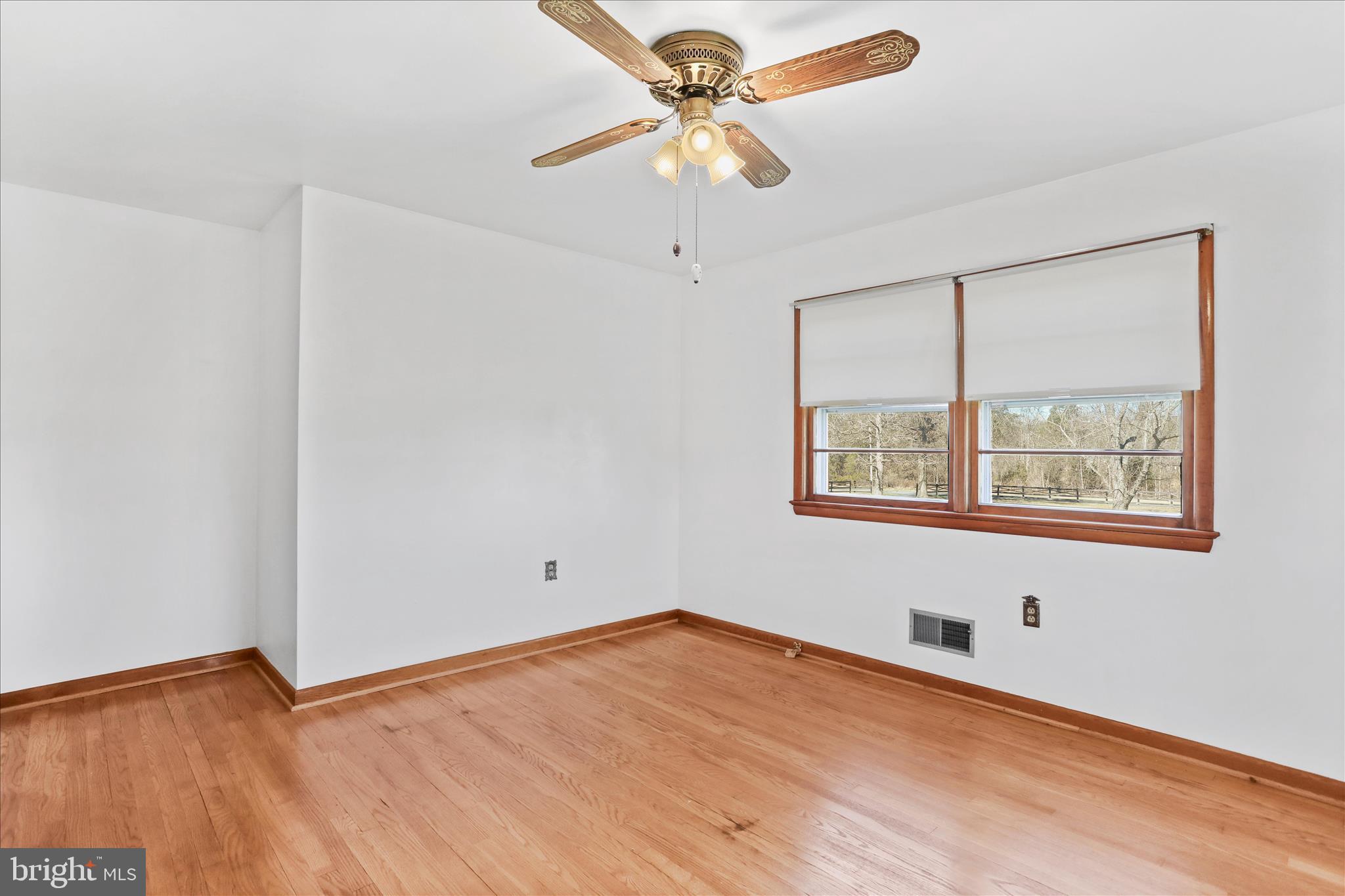 550 Bucks Mill Road Strasburg, VA 22657 - Photo 26 of 57 an empty room with a window and a fan