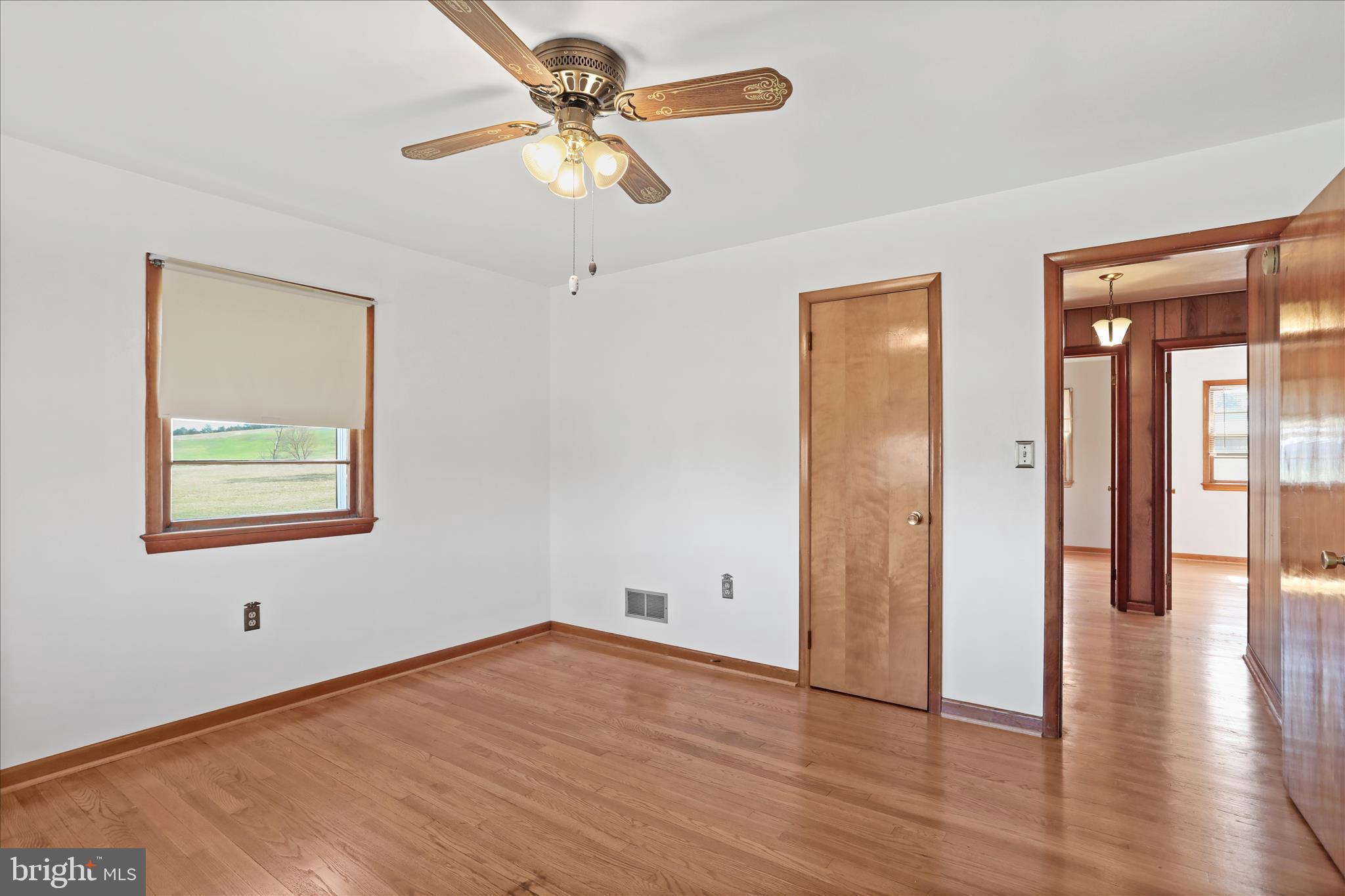 550 Bucks Mill Road Strasburg, VA 22657 - Photo 27 of 57 wooden floor in an empty room with a window