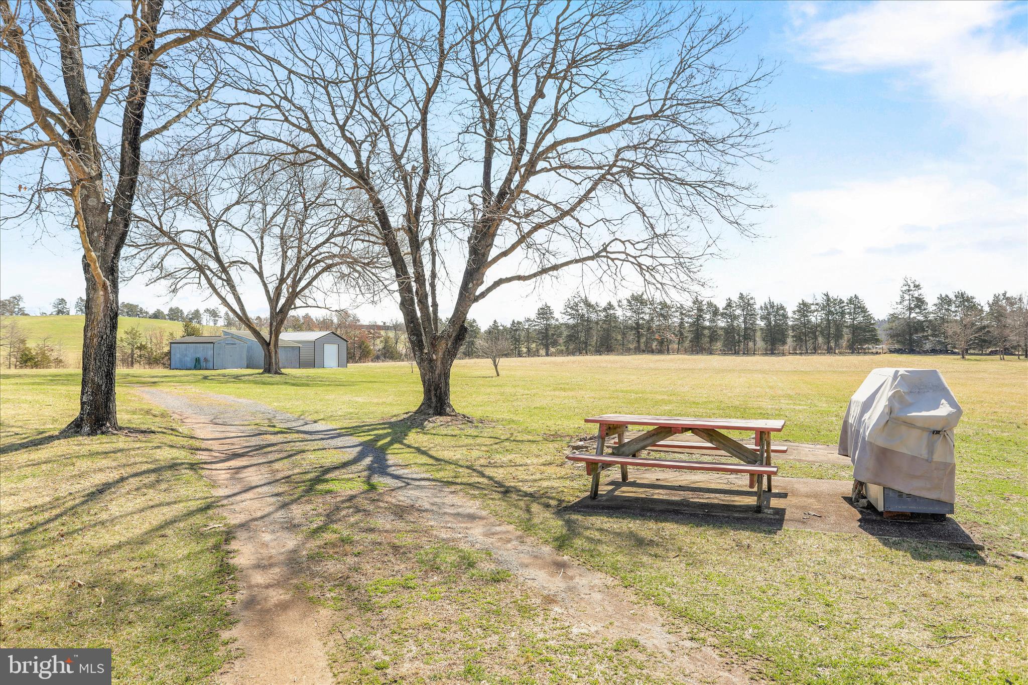 550 Bucks Mill Road Strasburg, VA 22657 - Photo 35 of 57 a view of a lake with couches and wooden fence