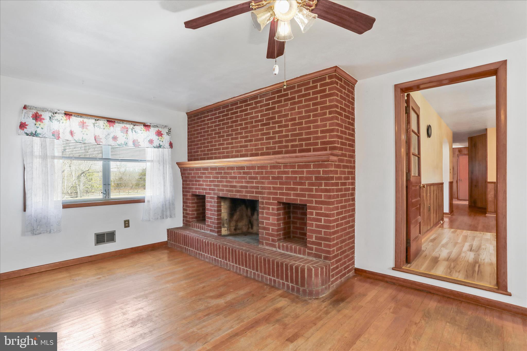 550 Bucks Mill Road Strasburg, VA 22657 - Photo 4 of 57 a view of empty room with fireplace and fan