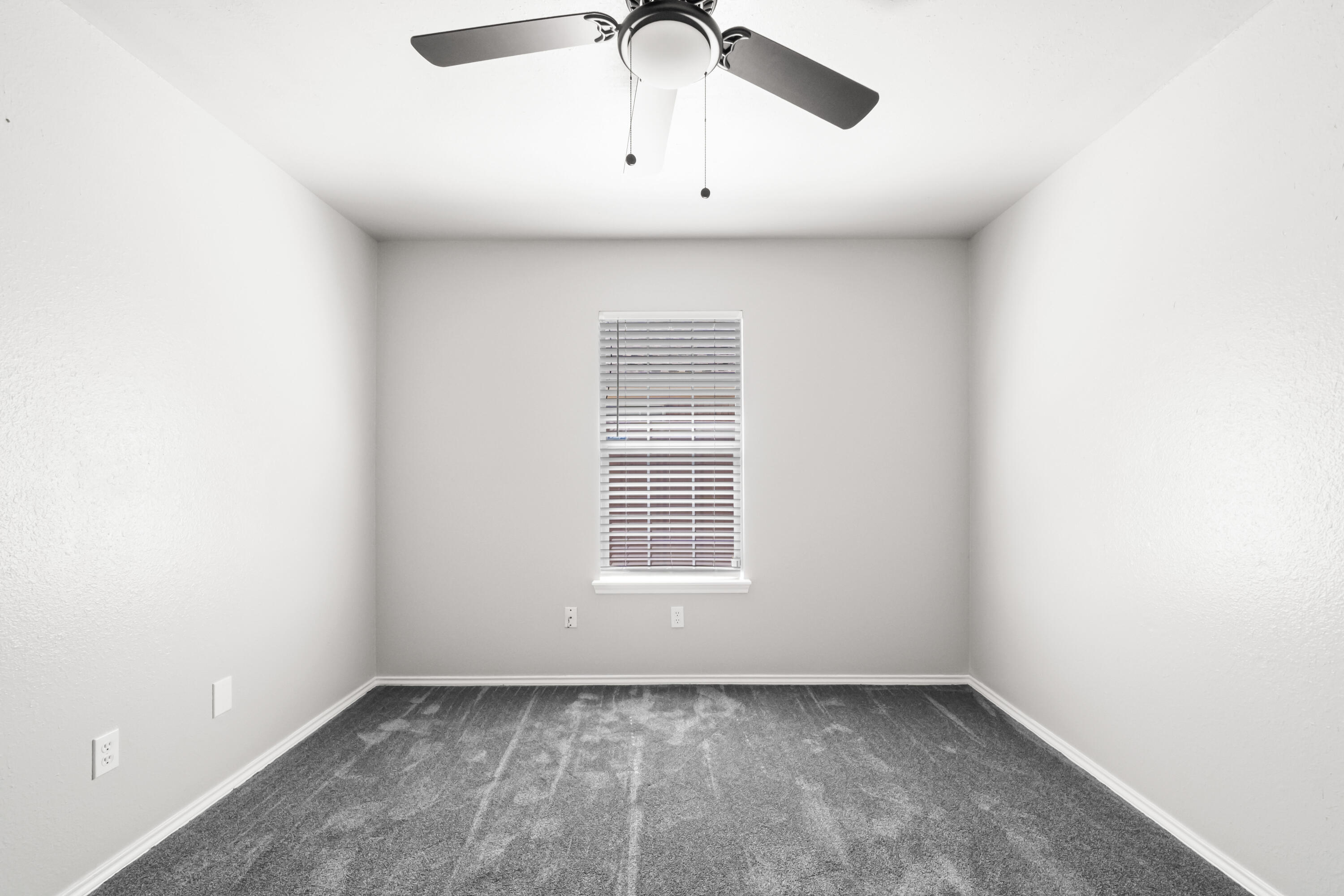 6201 5th Street Lubbock, TX 79416 - Photo 18 of 25 a view of an empty room with a window