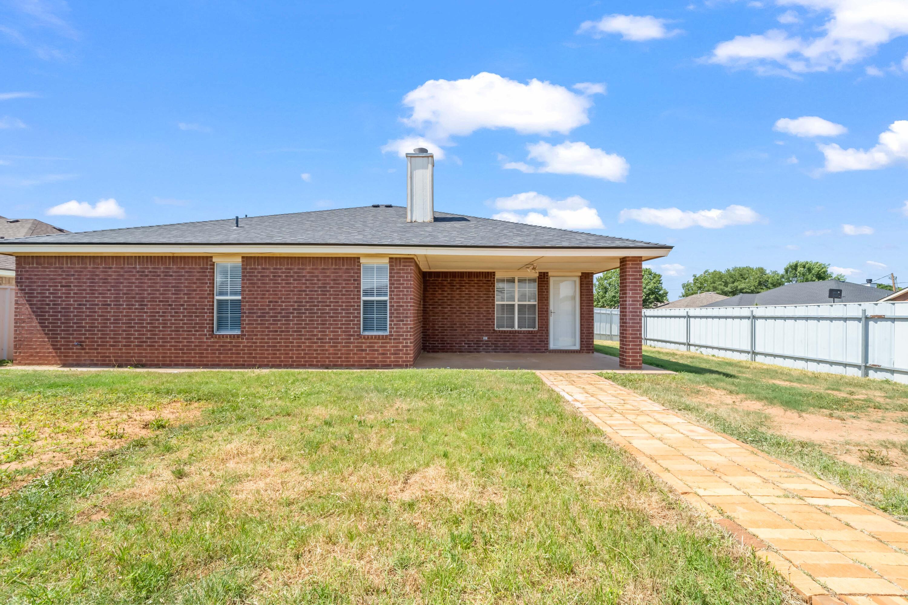 6201 5th Street Lubbock, TX 79416 - Photo 22 of 25 a view of a house with backyard and porch