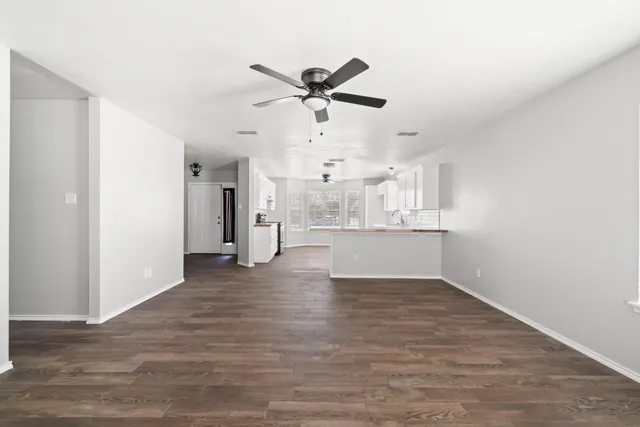 a view of a kitchen with a sink and cabinet area
