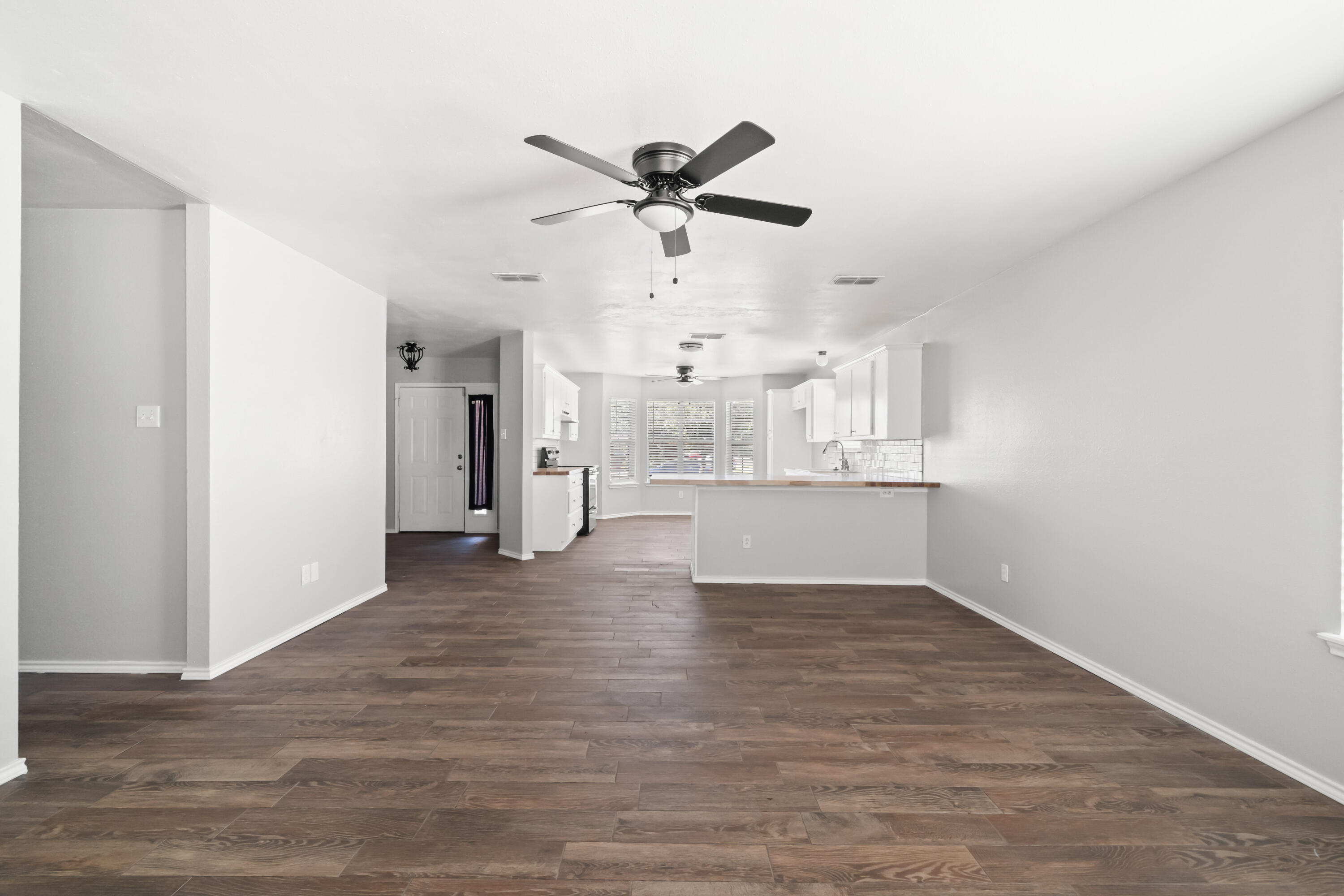6201 5th Street Lubbock, TX 79416 - Photo 3 of 25 a view of a kitchen with a sink and cabinet area