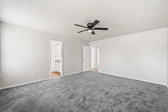 a view of a big room with carpet