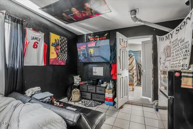 a bedroom with furniture and natural light