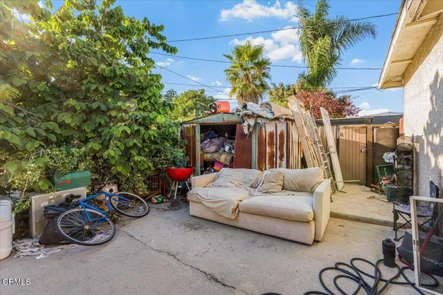 a view of backyard with outdoor seating