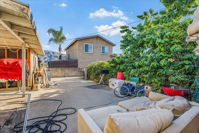 a view of a chairs and tables in the patio