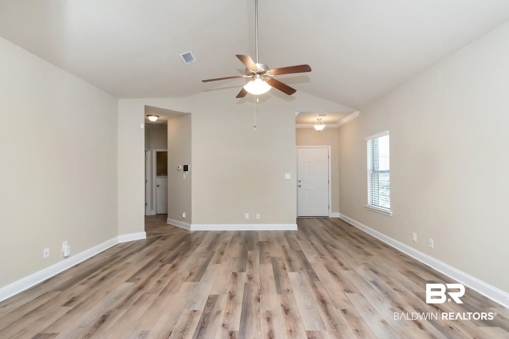 6144 Whitebark Drive Mobile, AL 36693 - Photo 6 of 33 Spare room with light wood-type flooring, ceiling fan, and lofted ceiling