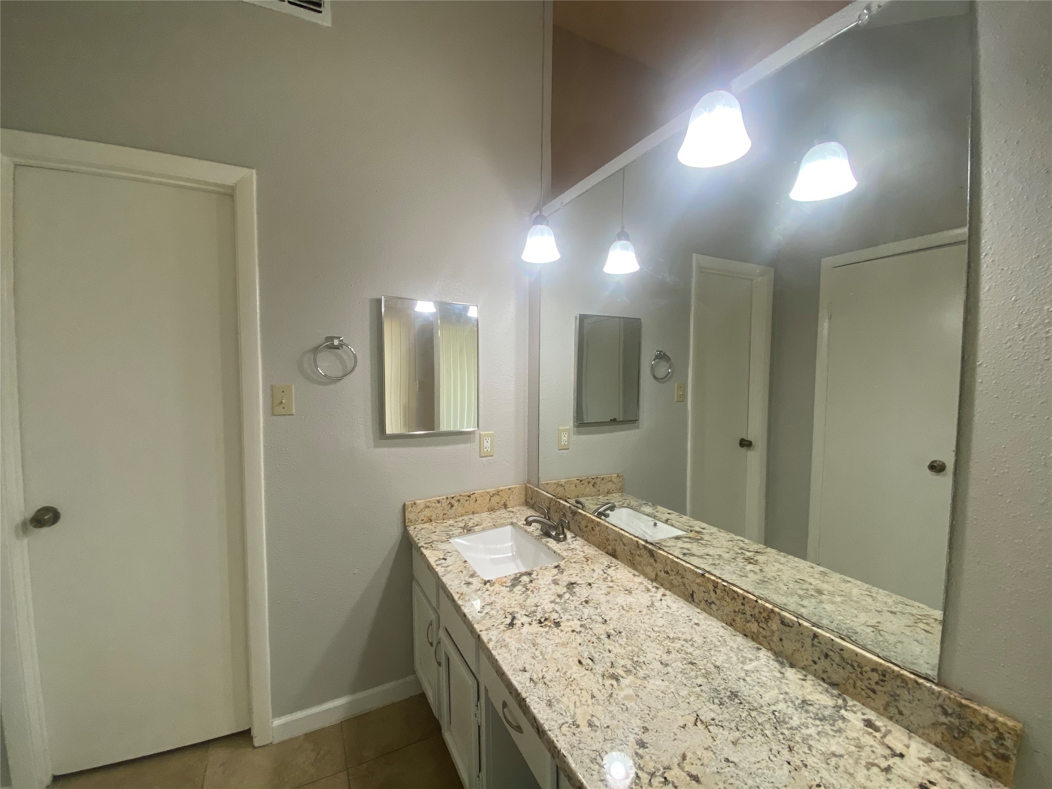 1330 Somercotes Lane Channelview, TX 77530 - Photo 10 of 13 a bathroom with a granite countertop sink a mirror and a shower