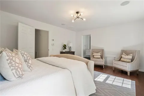 a bedroom with bed and window