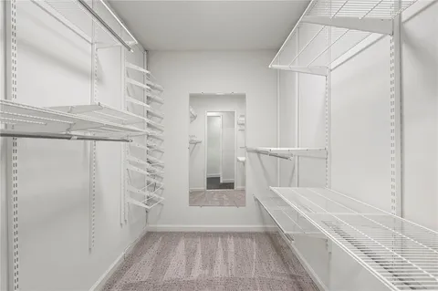 a view of a bathroom with a tub and shower