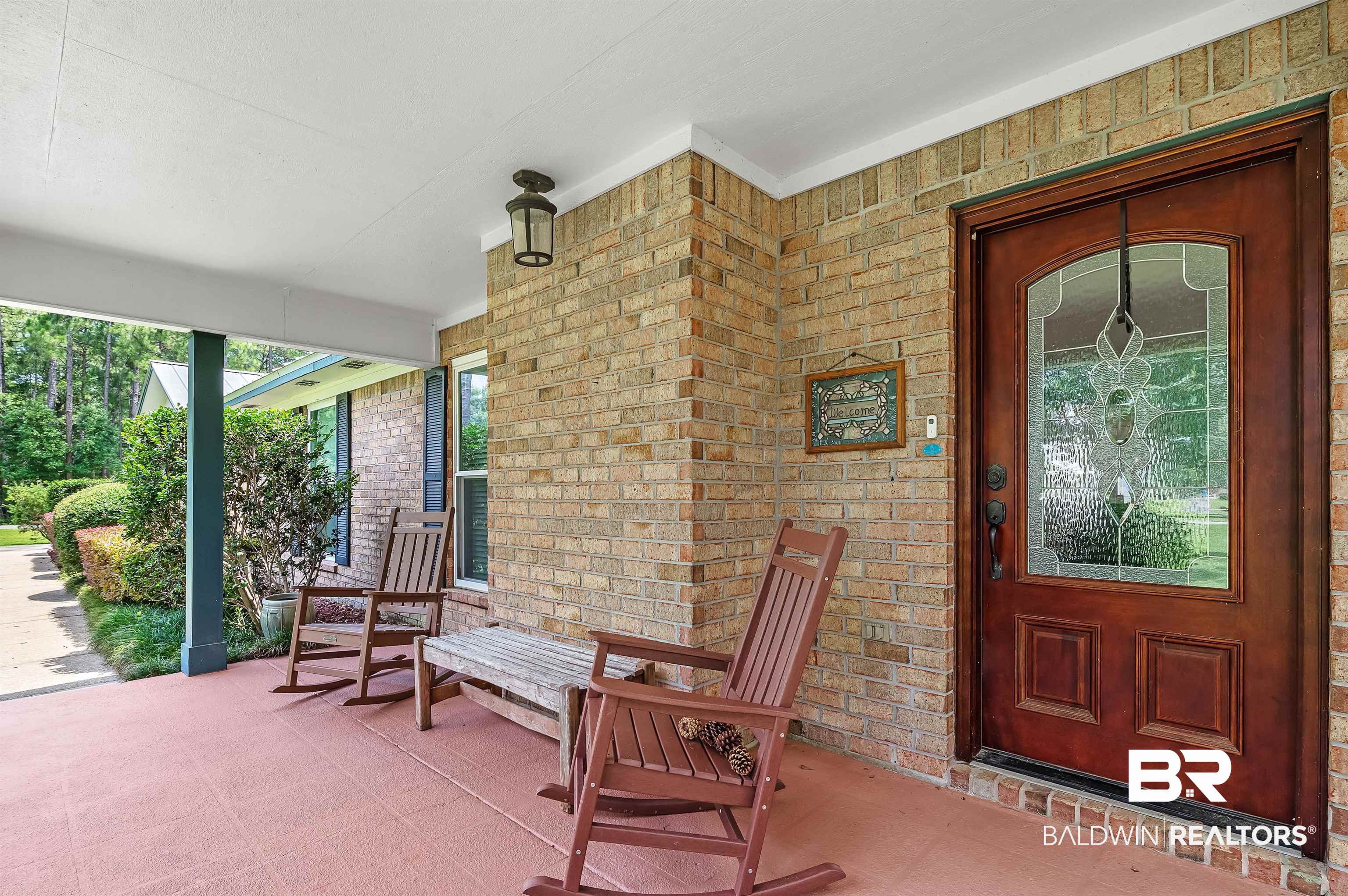 24551 Wolf Bay Drive Foley, AL 36535 - Photo 4 of 59 Entrance to property with a porch and brick siding