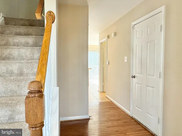 a view of an empty room with a ceiling fan