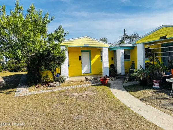a view of a house with basketball court