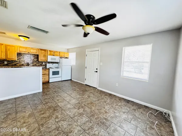a view of a electric appliances in kitchen and empty room