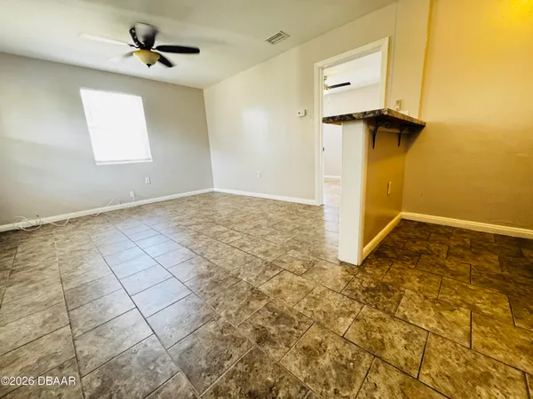 a view of empty room with windows