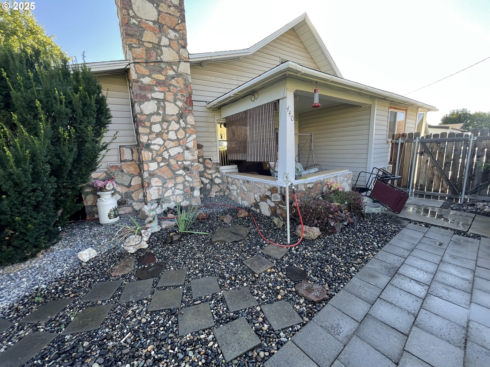 440 West Riverside Street Heppner, OR 97836 - Photo 11 of 22 a front view of a house with garden